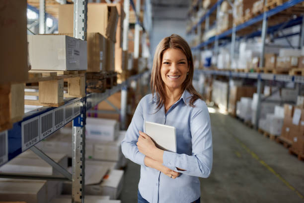 istock Happy female inspector working in storage room. 2163142435