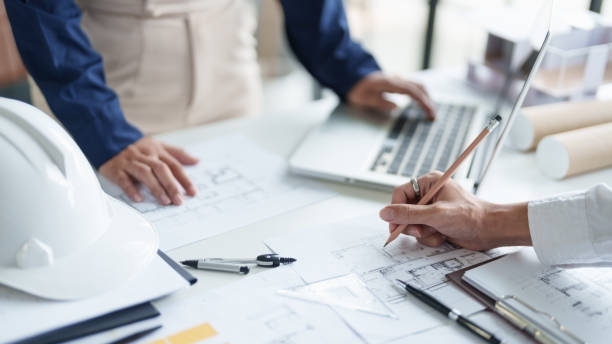 istock Architecture drawing on architectural project business architecture building construction Colleagues designer Planning Design on blueprint and compasses 2163144760