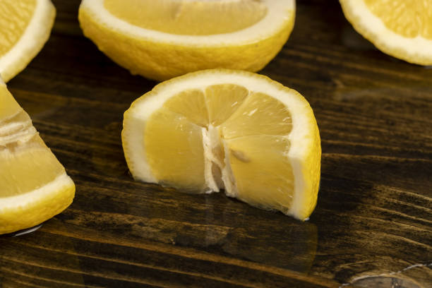 istock ripe sliced lemon on a board 2163145282