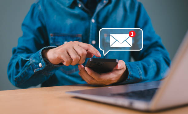 istock Email alert concept. New email notification, business e-mail communication, digital marketing, internet technology. Inbox receives electronic message campaign. People touch on mail virtual screen 2163146669
