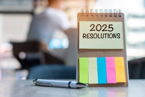 istock 2025 Resolution word on note paper with pen on wooden table. strategy, solution, goal, business, New Year New You and happy holiday concepts 2163150895