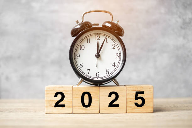 istock 2025  text with clock on table. Resolution, time, plan, goal, motivation, reboot, countdown and New Year holiday concepts 2163151192