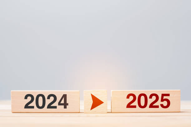 istock 2025 and 2024 wooden block on table background. Resolution, strategy, countdown, goal, change and New Year holiday concepts 2163151403