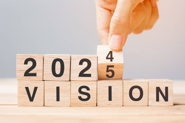 istock hand flipping block 2024 to 2025 VISION text on table. Resolution, strategy, goal, motivation, reboot, business and New Year holiday concepts 2163151450