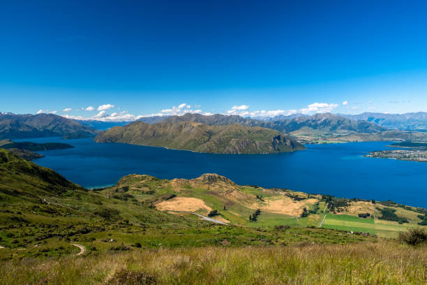 istock Grassy Hills Under Blue Sky 2163152699