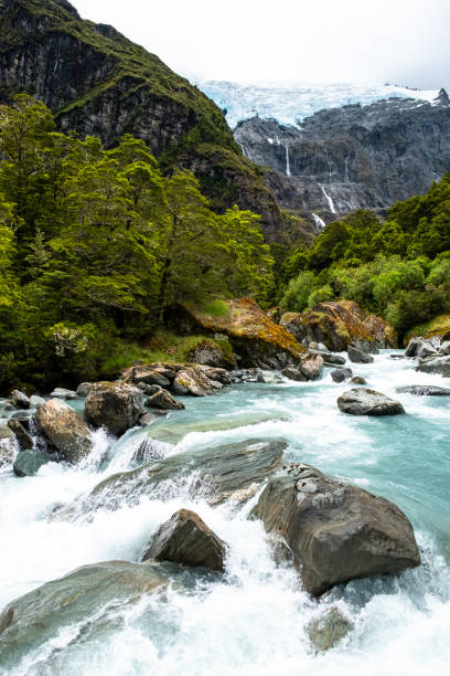 istock River and Waterfall in Mountain Valley 2163152872