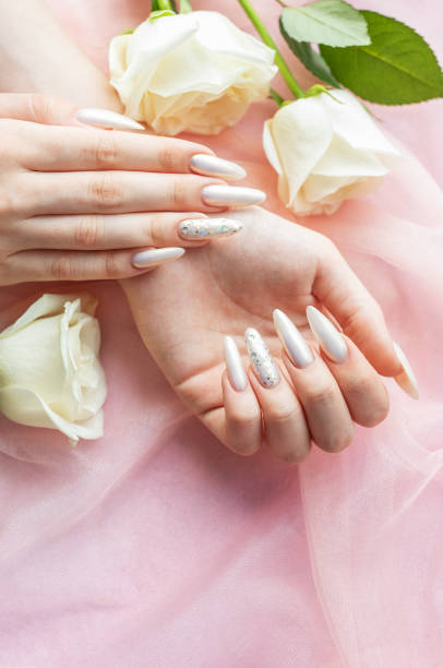 istock Female Hands with beautiful pearl manicure 2163153335