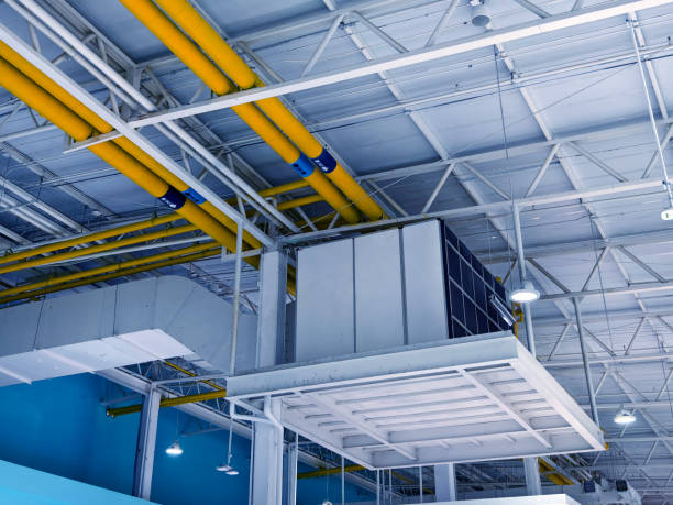 istock Ceiling with ventilation pipes and lights in industrial building 2163154992