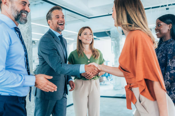 istock Business people shaking hands in the office 2163155577