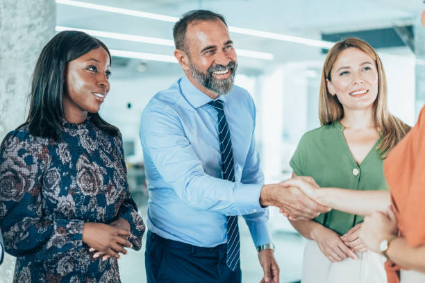 istock Business people shaking hands in the office 2163155580