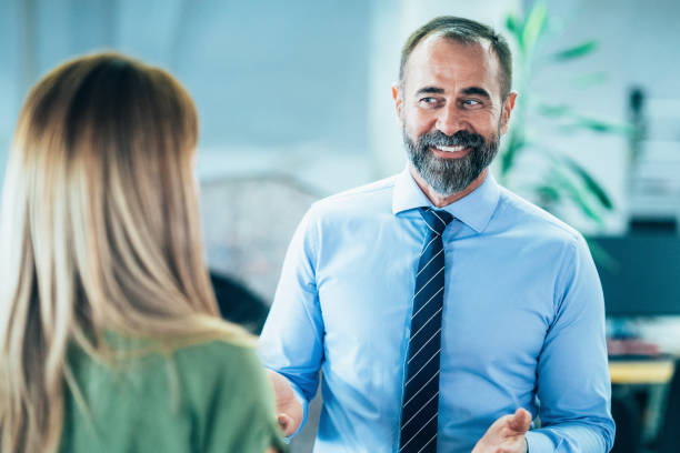 istock Business colleagues talking in the office 2163155597