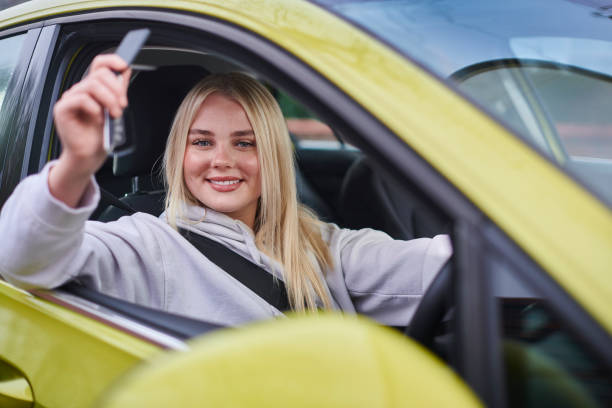 istock keys to her first car 2163155611
