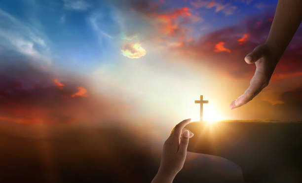 istock Jesus helping hand concept: World Peace Day Help hand on sunset background 2163157001