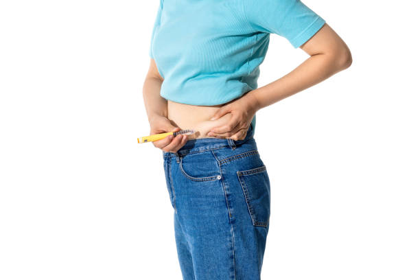 istock injecting self with obesity medication 2163159650