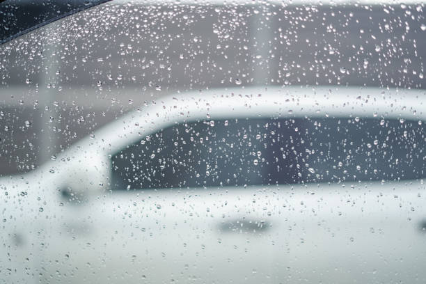 istock water drops on car glass 2163160398