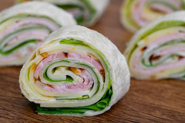 istock A cold party snack, a tortilla roll with cheese and ham 2163160700