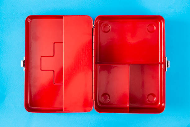 istock Red first aid kit box, opened, flat lay  on blue background, empty copy space for product placement 2163161470