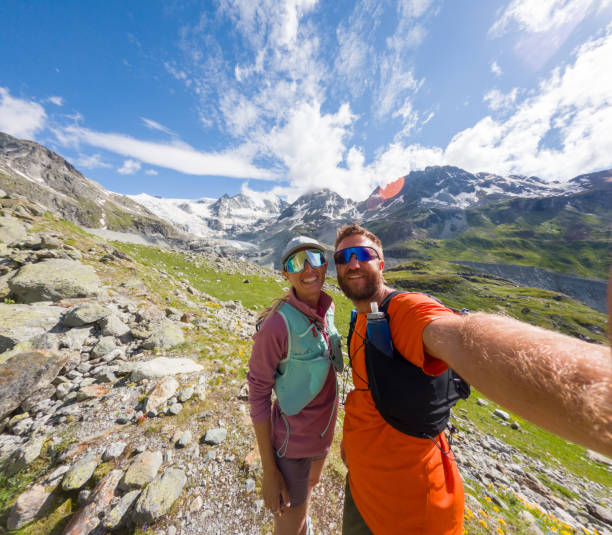 istock Couple Taking Selfie on Mountain Hike with Scenic View 2163163539