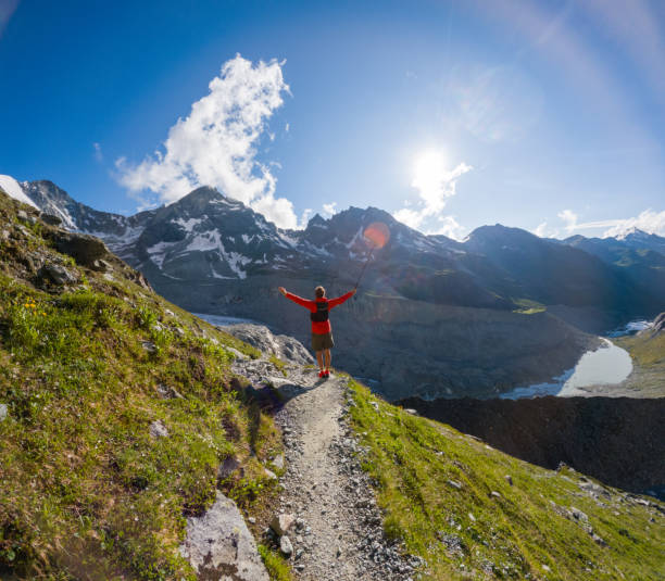 istock Hiker Celebrating on Mountain Trail with Scenic View 2163163648
