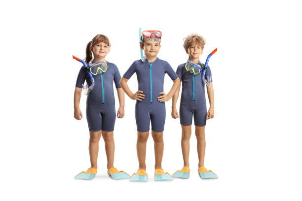 istock Children in wetsuits, diving masks and flippers posing 2163164130