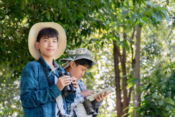 istock Asian boys with birdwatching activity 2163165096