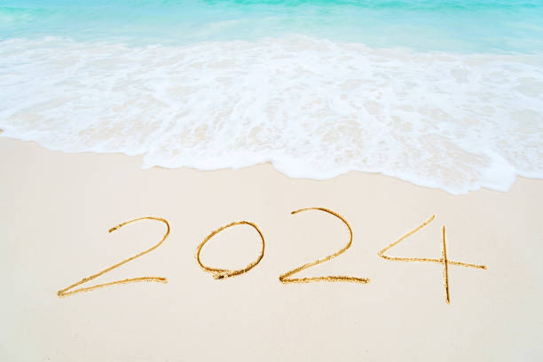 istock 2024 written on sandy beach 2163165324