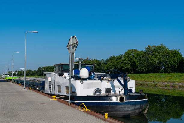 istock A white cargo ship is docked at a canal. 2163168273