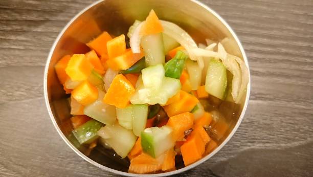 istock Acar timun, traditional Indonesian cucumber pickle. A complementary food containing fermented diced carrots and cucumbers. 2163168832