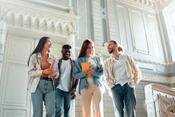 istock College students bonding in a historic building stairwell on campus, creating a lively atmosphere 2163169749