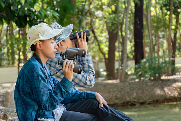 istock Asian boys with birdwatching activity 2163174058