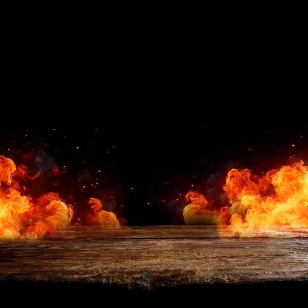 istock Fire flames isolated on wooden table and black wall background, copy space for products. 2163176200