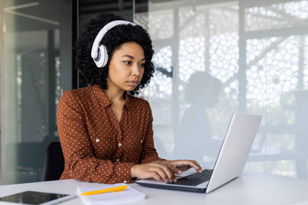 istock Focused businesswoman using laptop at modern office 2163176211