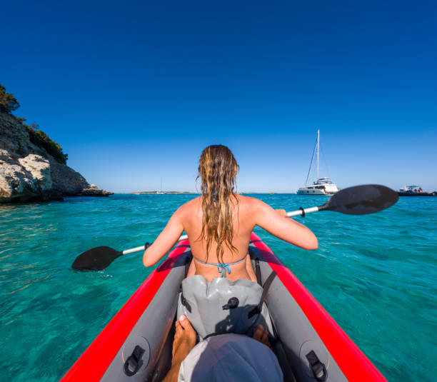 istock Woman Kayaking in Turquoise Waters 2163176300