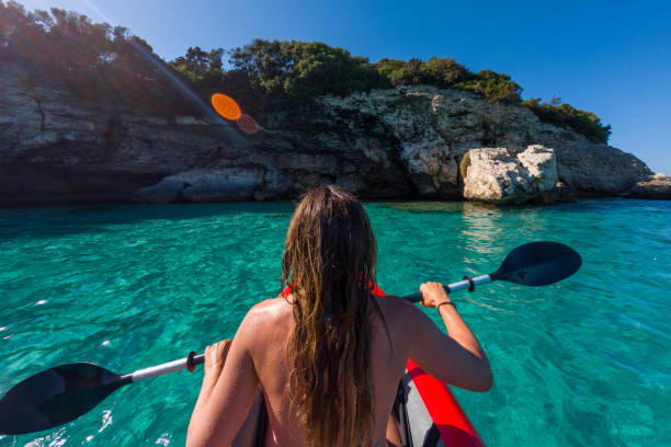 istock Woman's Scenic Kayaking in Sparkling Turquoise Waters 2163176409