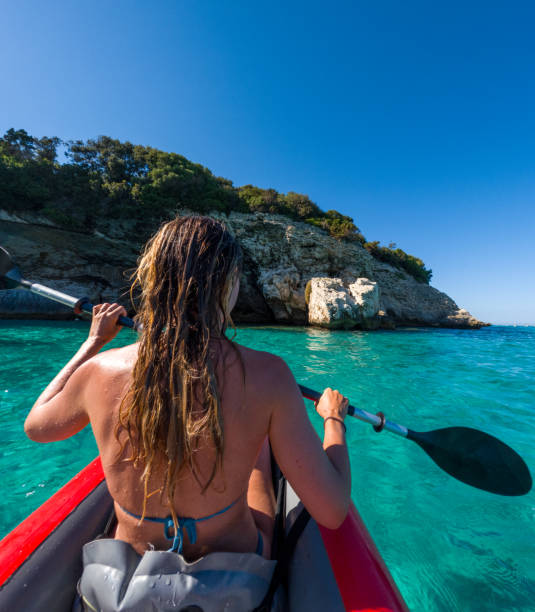istock Kayaking Adventure: Woman in Stunning Turquoise Waters 2163176438