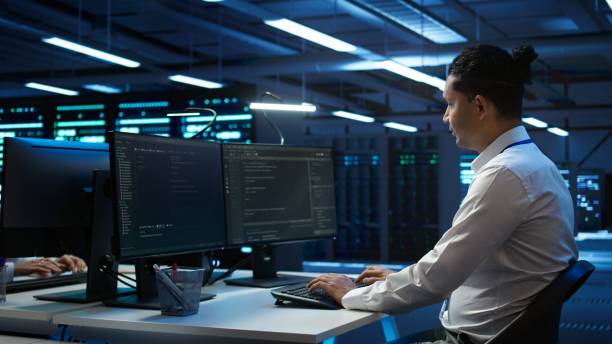 istock Portrait of upbeat admin in data center managing servers 2163176518