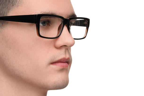 Young man with glasses on white background, closeup