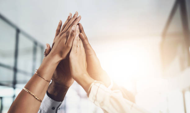 istock Hands, high five and business people with agreement, success and celebration with teamwork. Collaboration, company and group with professional achievement and solidarity at creative job with mockup 2163177502