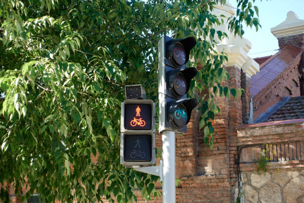 A traffic light that is green to allow pedestrians and bicycles to cross the roadway. Copy space