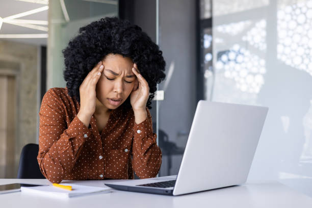 istock Professional woman feeling stressed at her office desk 2163179146