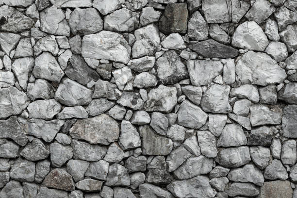 istock pattern of modern style decorative uneven cracked real gray color stone wall surface 2163179515