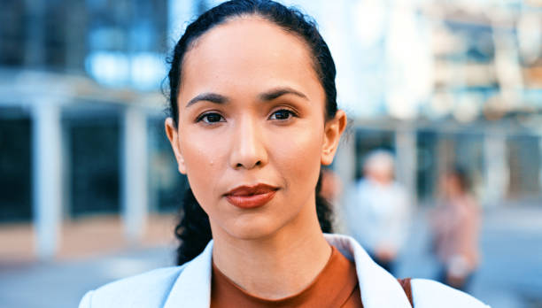 istock Confident Businesswoman Standing in Modern Urban Street Setting 2163179556