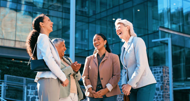 istock Diverse Businesswomen Enjoying a Lively Conversation Outdoors in a Modern Urban Setting 2163179583