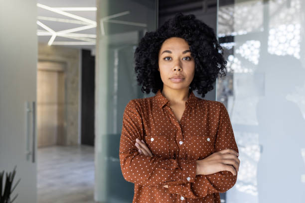 istock Confident young businesswoman in a modern office setting 2163180495