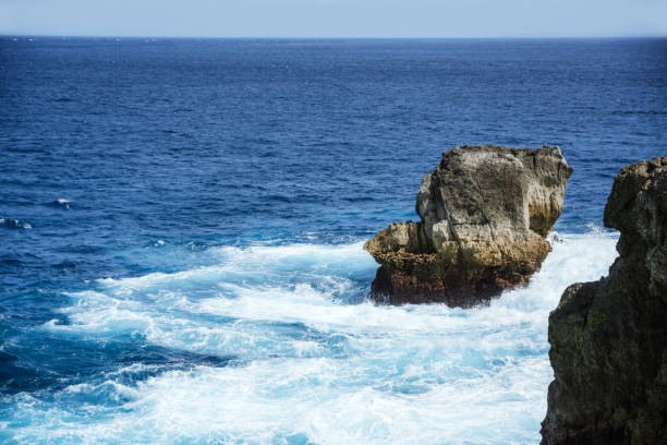 Rocky Coastline  in Nusa Penida, Indonesia, showcasing the raw beauty and dynamic ocean landscape.