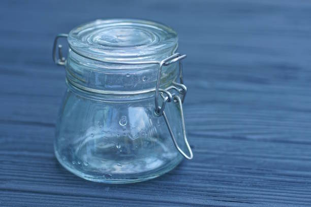 istock empty closed jar stands on a black wooden table 2163184718