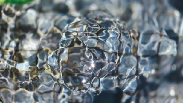 istock Ornamental pond with light reflections and ripple 2163187164