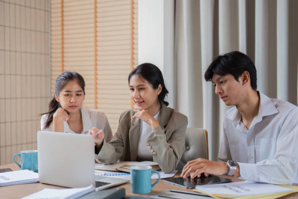istock Business Professionals Collaborating and Exchanging Ideas in a Modern Office Setting 2163187433