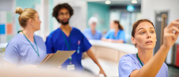 istock updating ward notes in nursing station 2163190287