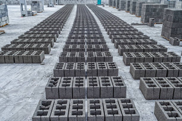 istock Rows of concrete cinder blocks, building material in form of gray bricks. Use on construction site. 2163190406